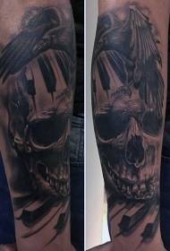 arm black gray crow with skull and piano key tattoo pattern