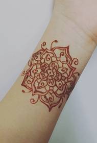 stitched flower wrist tattoo is very angry
