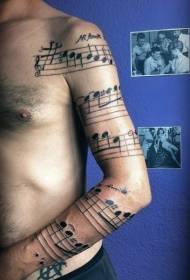 arm Black note with letter tattoo pattern