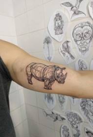 Schoolgirl arm on black line creative rhinoceros animal tattoo picture