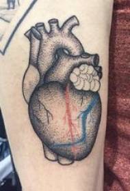 Heart tattoo boy's arm on black tattoo prickly heart tattoo picture