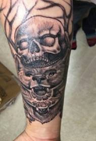 Boy's arm on black gray sketch point thorn trick skull animal tattoo picture
