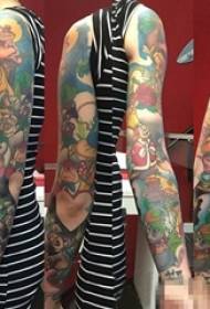 Boys on the arm painted anime Alice in Wonderland flower arm tattoo pictures