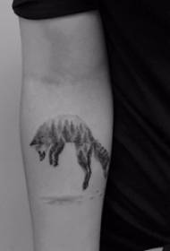 Arm tattoo picture boy arm on black tree and fox tattoo picture