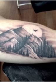 Boys arm on black gray point thorn skill mountain and tree landscape tattoo pictures