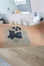 Little fresh cat tattoo girl with black cat tattoo picture on arm