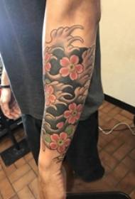 Japanese tattoo, boy's arm, colored flowers, tattoo picture