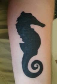 Schoolboy arm on black simple line small animal silhouette hippocampus tattoo picture