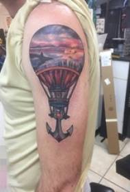 Schoolboy arm painted abstract lines anchor and hot air balloon tattoo picture