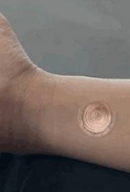 Boys Arms on Rose Gold Spiral Road Tattoo Picture