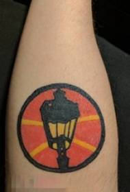 Boy's arm on painted ink street lamp sign tattoo picture