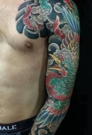 Japanese tattoo, male arm, colored flower arm tattoo picture