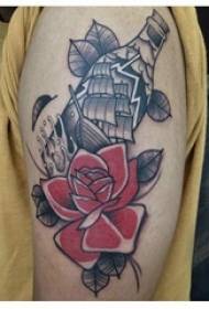 Brazo del niño en negro gris punto de dibujo espina habilidad velero literario hermosa flor tatuaje foto