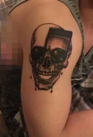 Schoolboy arm on black sketch creative note skull tattoo picture