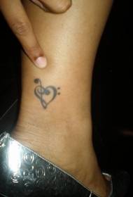 heart-shaped tattoo picture of the leg simple treble clef