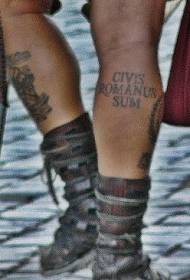 Black latin alphabet tattoo pattern on the legs