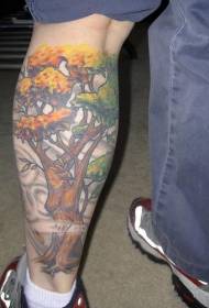 Modello femminile del tatuaggio del grande albero di colore della gamba