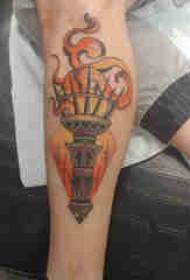 European calf tattoo male shank on colored torch tattoo picture