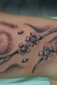 female legs brown cherry tree tattoo pattern