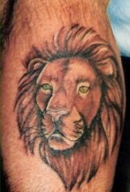 pierna marrón ojos verdes cabeza de león tatuaje foto