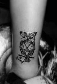 Little owl leg tattoo pattern hanging on a branch