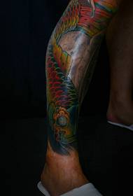Golden squid tattoo covered by the entire calf