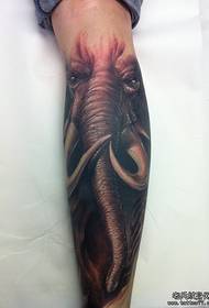 An elephant tattoo on the calf
