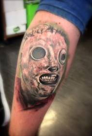 Masked monster tattoo pattern in horror movie on calf