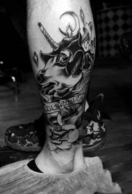 Black and white horse head calf tattoo
