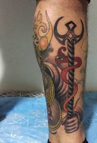 Handsome color elephant tattoo that falls on the calf