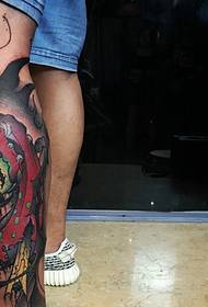 Colorful tattoo pictures of different patterns on the calf