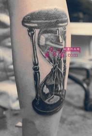Beautiful black and white hourglass calf tattoo