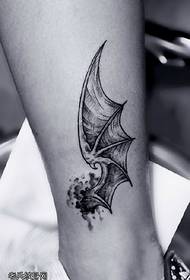 Bat wings tattoo pattern on calf