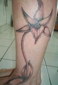 Ang natatanging pattern ng itim na orchid na tattoo ng calf