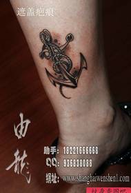 Female calf anchor tattoo