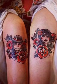 a couple of tattoos with a boom