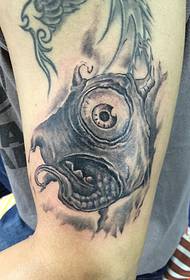 Big arm, a funny little monster tattoo