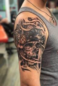 Skull and wolf tattoo pattern black and gray sly and wolf tattoo picture on boy's arm