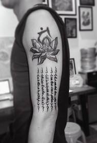 Big arm tattoo tattoo with lotus and Sanskrit