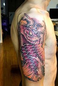 Big arm with vibrant red squid tattoo pattern