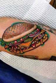 El braç gran del noi del tatuatge d'aliments en la imatge de tatuatge d'aliments de colors