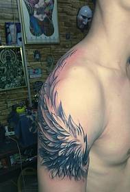 Men's big arm personality handsome feather tattoo pictures