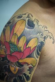 Traditionally bright and colorful big arm lotus tattoo pattern