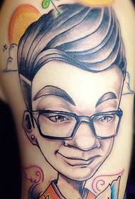 A very handsome little boy portrait tattoo on the big arm