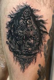 skull tattoo, male horrible tattoo on the thigh