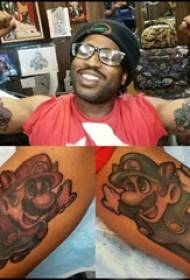 Cartoon character tattoo boy with big arm on colored mario tattoo picture