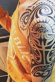 Handsome big arm Maya totem tattoo