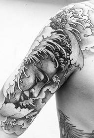 Storarm buddha svartgrå tatoveringsmønster