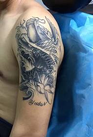 Small squid tattoo pattern falling on the big arm