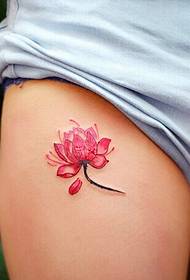 A lotus tattoo falls on the white lap